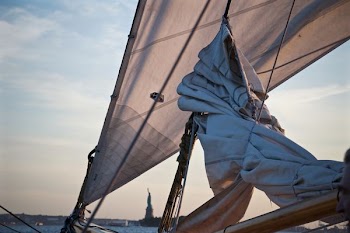 white sailboat travelling during daytime