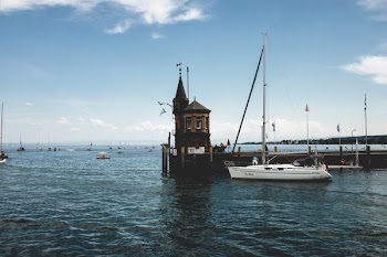 White Sailing Ship Near Dock