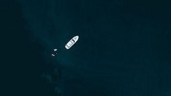 white ship on body of water