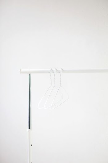 white steel cloth hangers on rack
