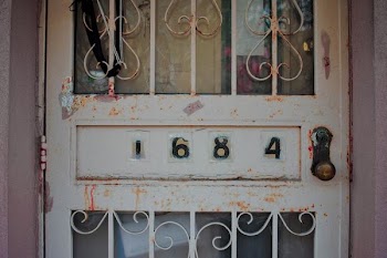 white steel door showing 1684