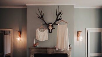 white textile hanging on wall