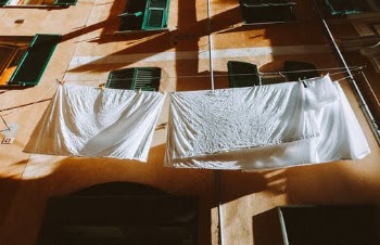 White Towel Hanged on Brown Wooden Wall · Free Stock Photo
