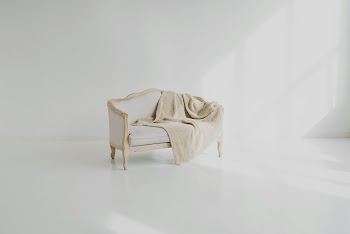 White Towel on White Wooden Sofa · Free Stock Photo