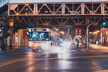 White Transit Bus On Asphalt Road