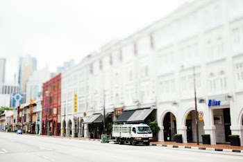 white truck parked near white building