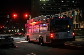 White Type C Motorhome on Road Near Red Traffic Light