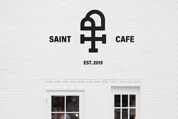 White Wall Mockup saint cafe est. 2019 