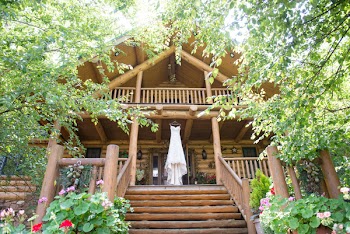 White Wedding Dress on Brown Wooden House