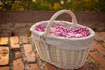 White Wicker Basket on Brick Surface