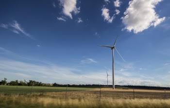 White Windmill Under Blue and White Sky at Daytime