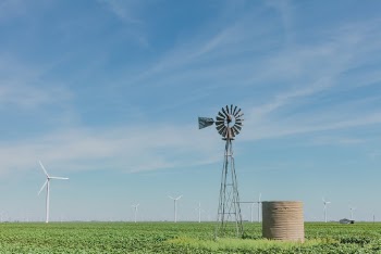 White Windmill Under Cloudy Sky
