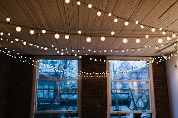 white window panel with string lights