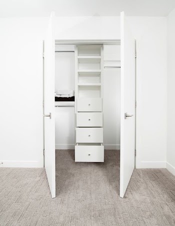 white wooden 2-door cabinet