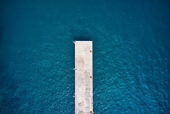 White Wooden Dock Above Water
