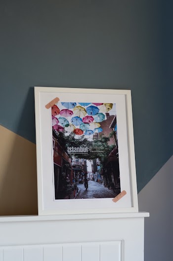 White Wooden Framed Picture of Assorted Color Umbrellas