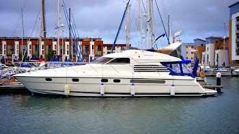White Yacht Docked on Port