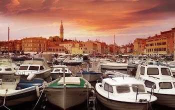 White Yachts on Body of Water during Sunset