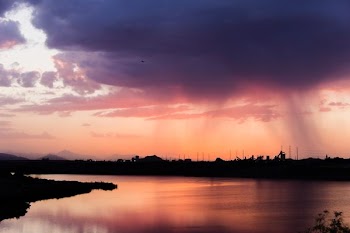 wide angle photo of body of water under cloudy sky