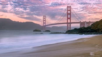 wide angle photo of Golden Gate Bridge under cloudy sky
