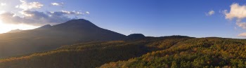 Wide Angle Photography of Mountain Under Cloudy Sky