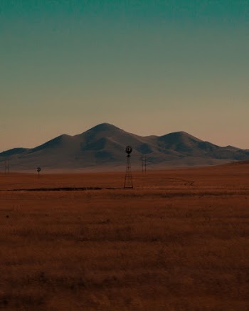 Wind Turbine on Landscape Field