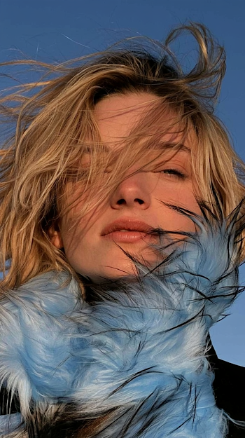 Windswept Blonde Model with Blue Fur Collar