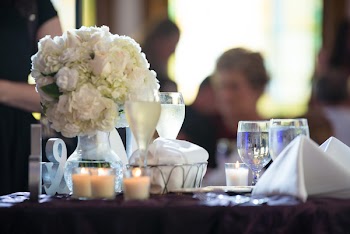 Wine Glasses and Flower Arrangement on Table