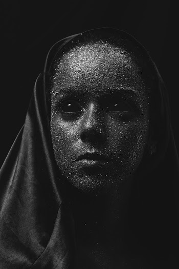 Woman's Face Covered With Glitters