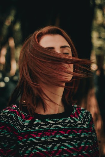Woman's Face Covered With Hair