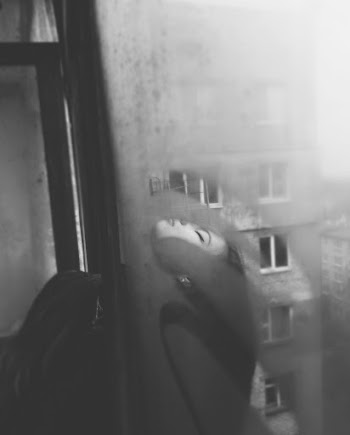 Woman's Head Outside the Window