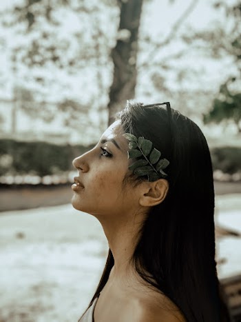 Woman's Portrait With Leaves On Her Hair