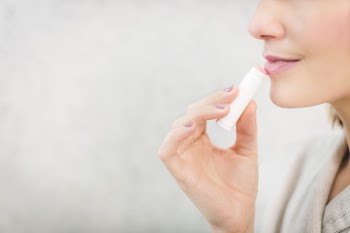 Woman About to Apply Pink Lip Balm