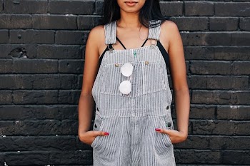 Woman Against Black Brick Wall