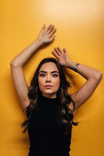 Woman Against Yellow Wall