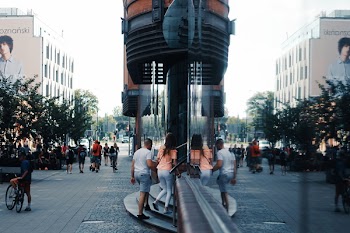 Woman And Entering A Building