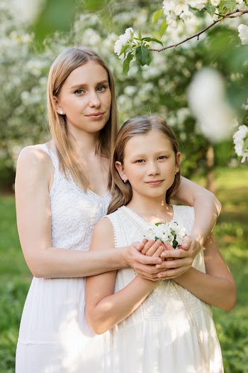 Woman and Girl Holding Flower Bouquet