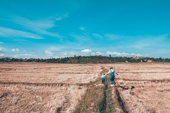 Woman and Girl on Farm Field