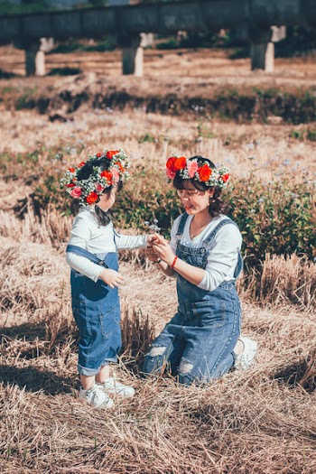 Woman and Girl on Grass Field