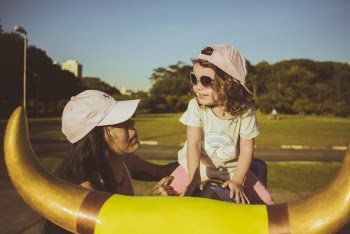 Woman and Girl on Mechanical Bull