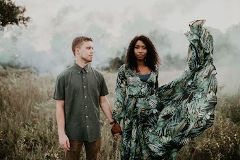 woman and man holding each other hands