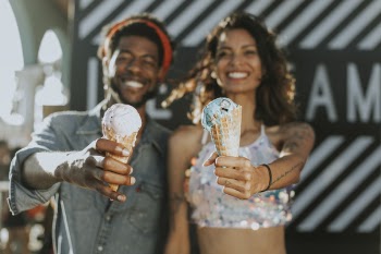 Woman and Man Holding Ice Creams