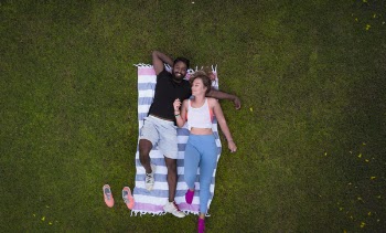 Woman and Man Lying on Rug