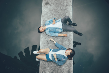 Woman and Man Lying on Walkway
