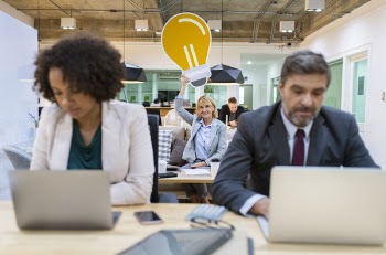 Woman and Man Sitting Near Desk With Laptops