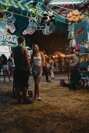 Woman and Man Standing Near Plush Toy