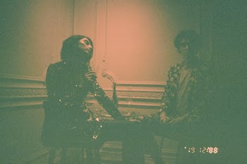 Woman and Man Standing Near Wal