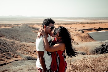 Woman and Man Standing on Hill