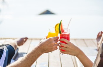 Woman and Man Toasting Drinks