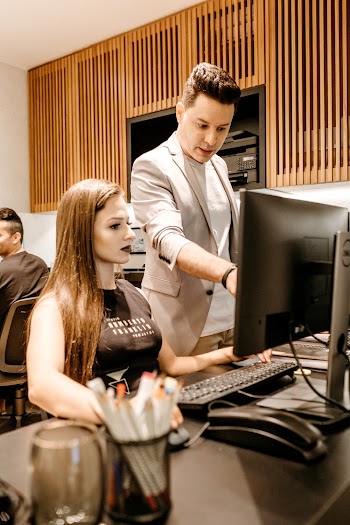 Woman and Man Using Computer